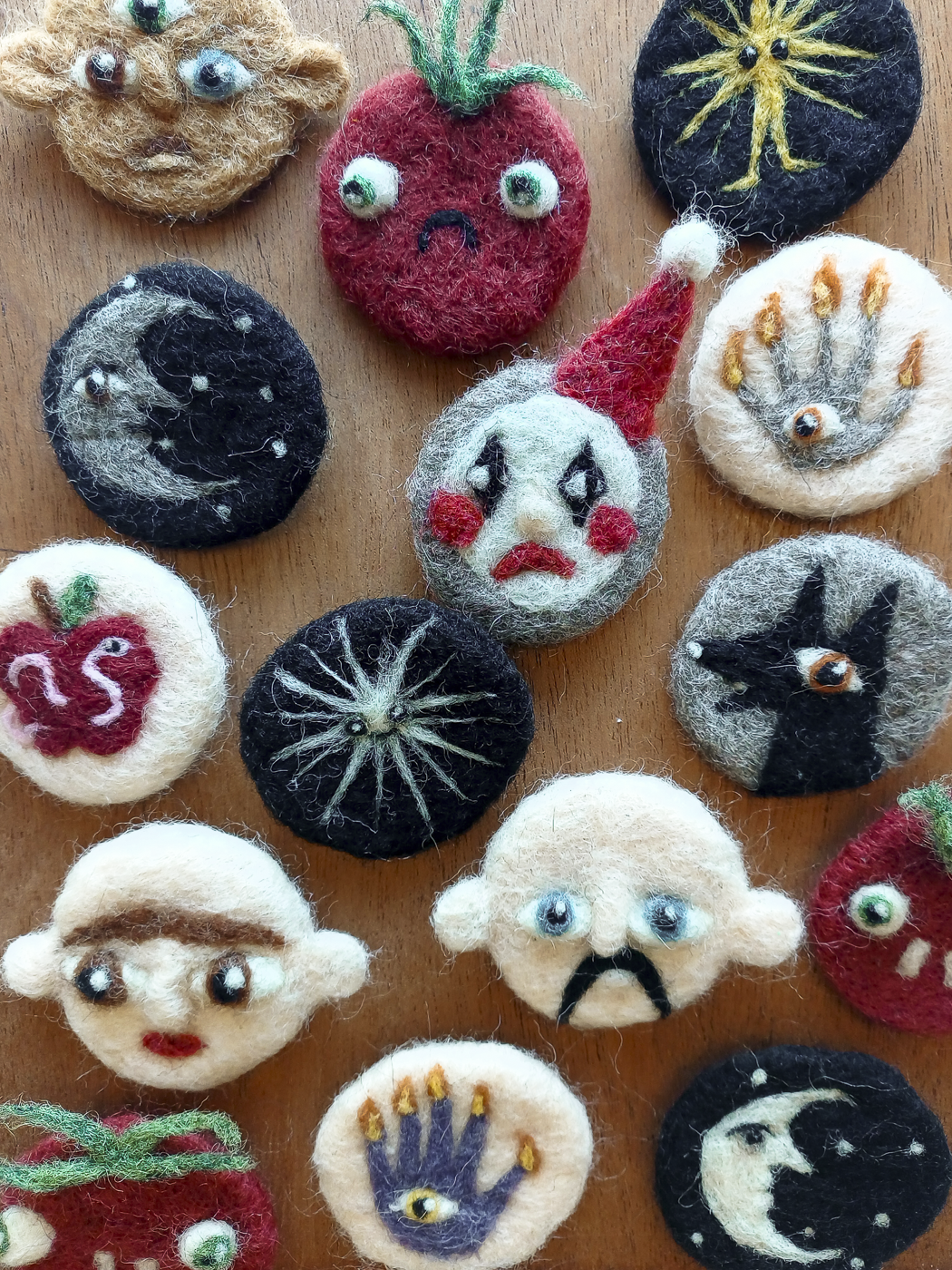 A colourful selection of needle felted brooches