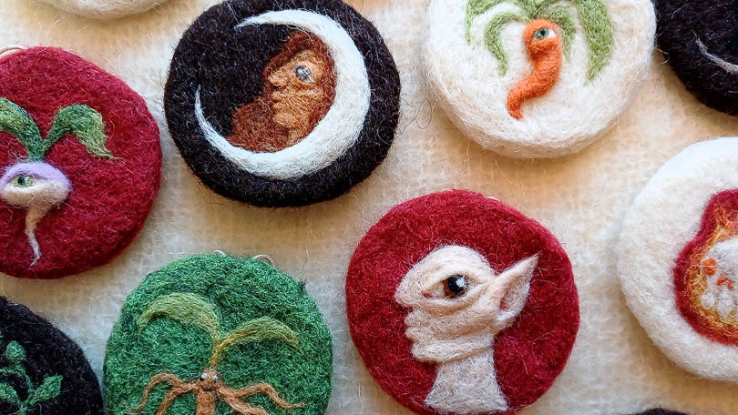A collection of needle felted hanging decorations inspired by medieval illustration and folklore
